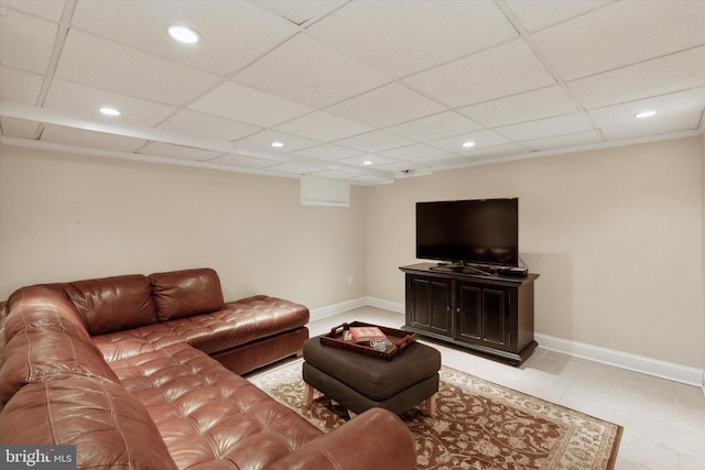 living room with a paneled ceiling, baseboards, and recessed lighting