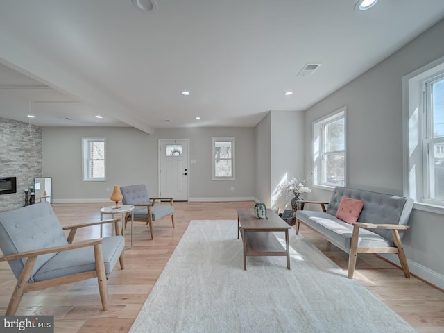 living area with light wood finished floors, recessed lighting, and baseboards