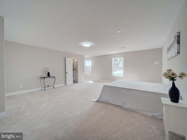 unfurnished bedroom with baseboards and carpet