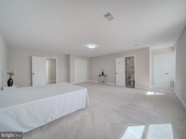 bedroom with visible vents, light carpet, and baseboards