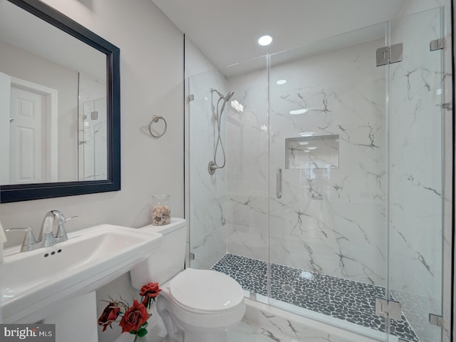 full bath with a sink, a marble finish shower, toilet, and marble finish floor