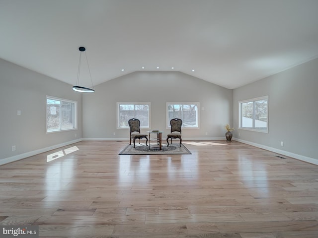 sitting room with a wealth of natural light and light wood-style flooring