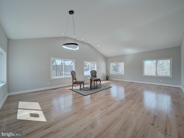 unfurnished room featuring high vaulted ceiling, recessed lighting, baseboards, and light wood-style floors