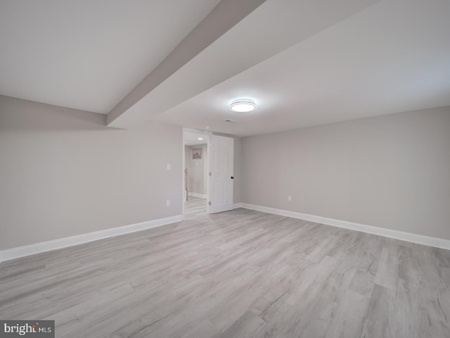 finished basement with light wood finished floors and baseboards