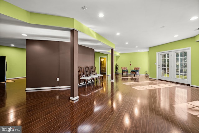 exercise room featuring recessed lighting, baseboards, and wood finished floors