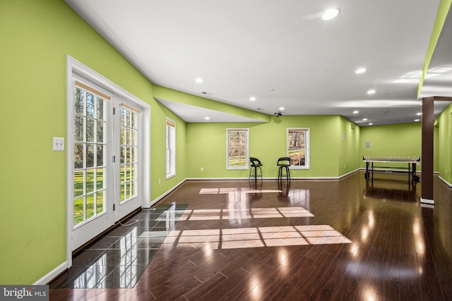 interior space with wood finished floors, recessed lighting, baseboards, and visible vents