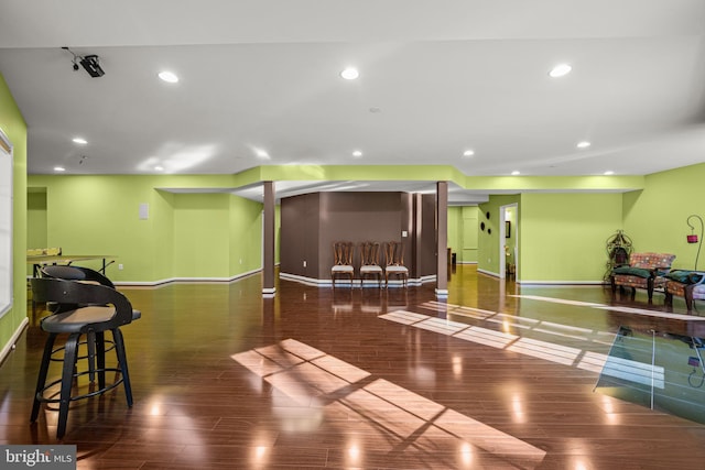 workout area with recessed lighting, baseboards, and wood finished floors