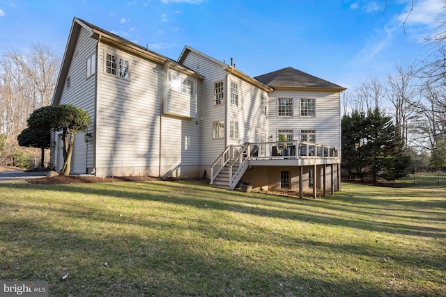 rear view of house featuring a wooden deck, stairs, and a yard