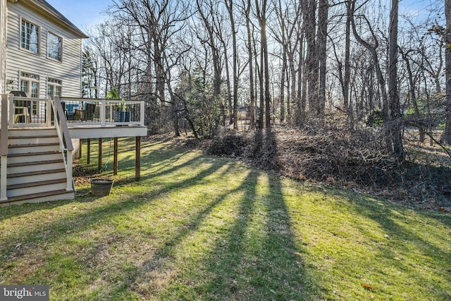 view of yard featuring stairs and a deck