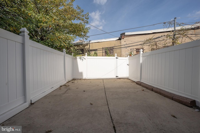 view of patio / terrace with a fenced backyard and a gate