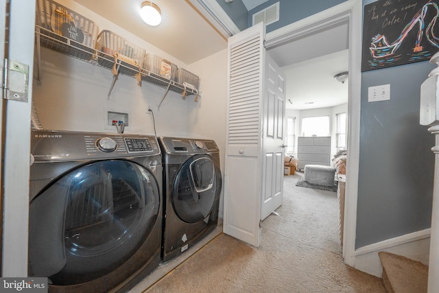 laundry room featuring carpet, laundry area, baseboards, and washing machine and clothes dryer