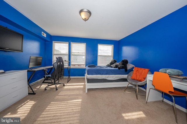 bedroom featuring visible vents and baseboards