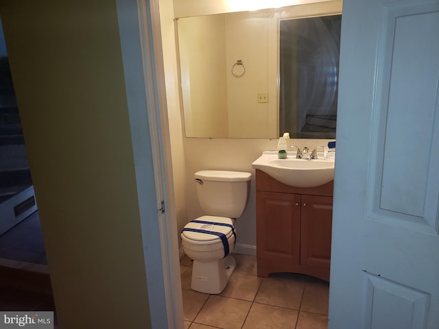 bathroom featuring vanity, toilet, and tile patterned floors