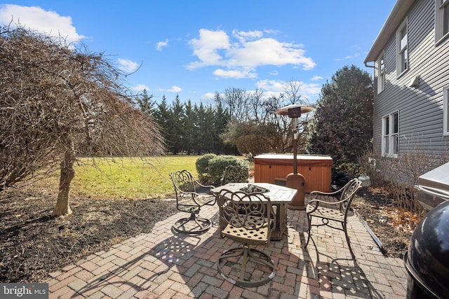 view of patio / terrace featuring a hot tub