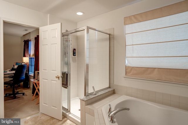 full bathroom with a stall shower, a garden tub, and visible vents