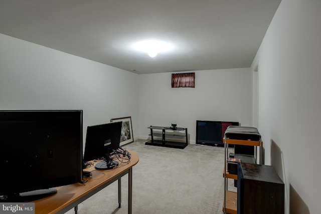 office area featuring light carpet