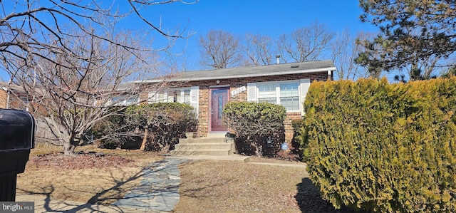 view of front of property featuring brick siding