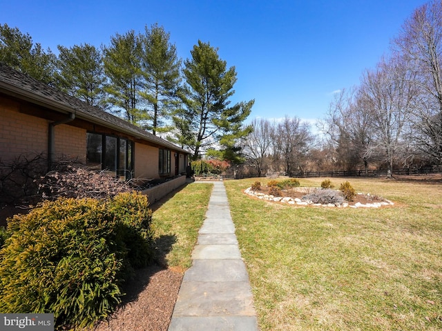 view of yard featuring fence