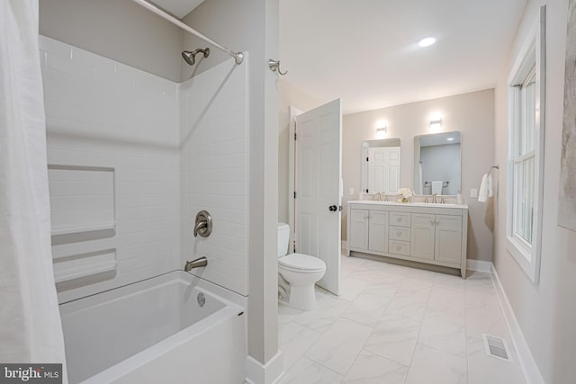 full bathroom with visible vents, bathing tub / shower combination, toilet, marble finish floor, and a sink