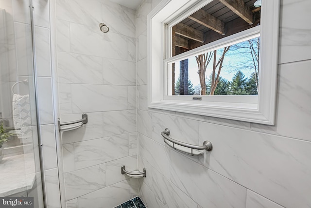 full bath featuring a shower stall