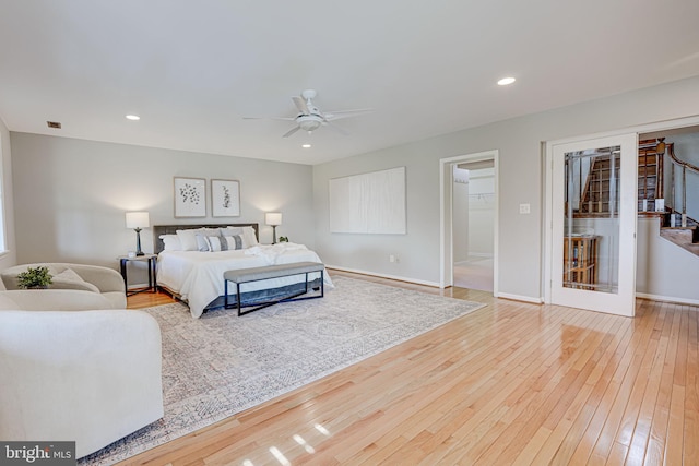 bedroom featuring a ceiling fan, recessed lighting, wood-type flooring, and baseboards