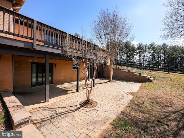 view of patio with stairs and a wooden deck