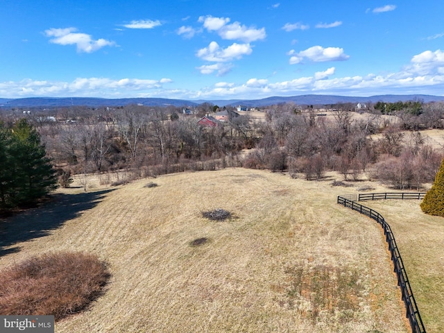 bird's eye view featuring a mountain view and a rural view