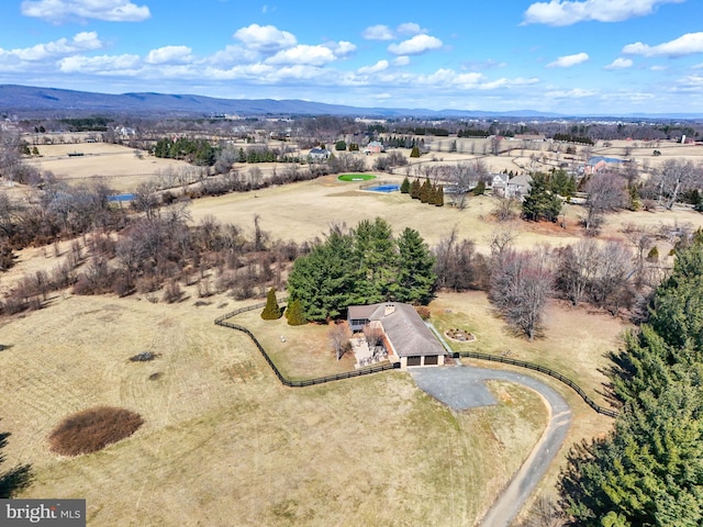 aerial view featuring a rural view and a mountain view