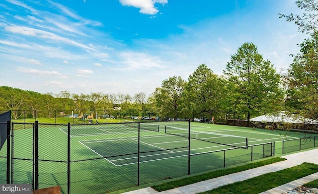 view of sport court with fence