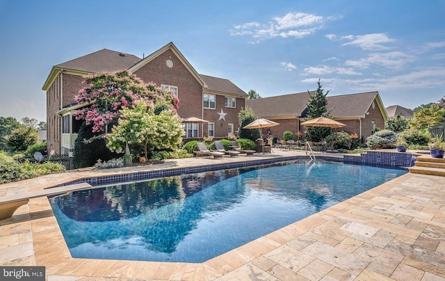 pool featuring a patio area