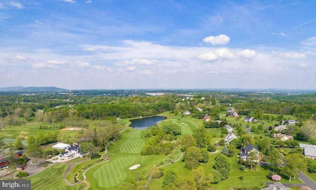 bird's eye view featuring golf course view, a forest view, and a water view