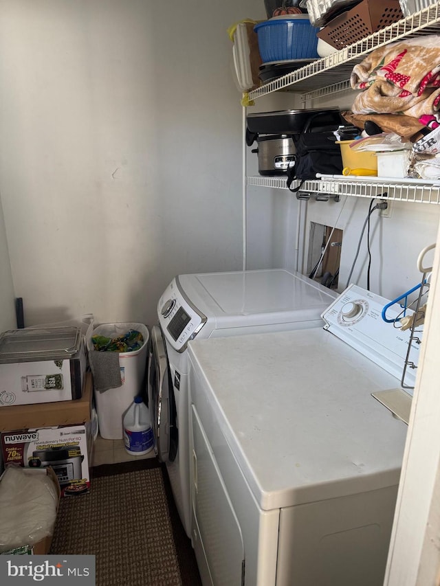 washroom with laundry area and washing machine and clothes dryer