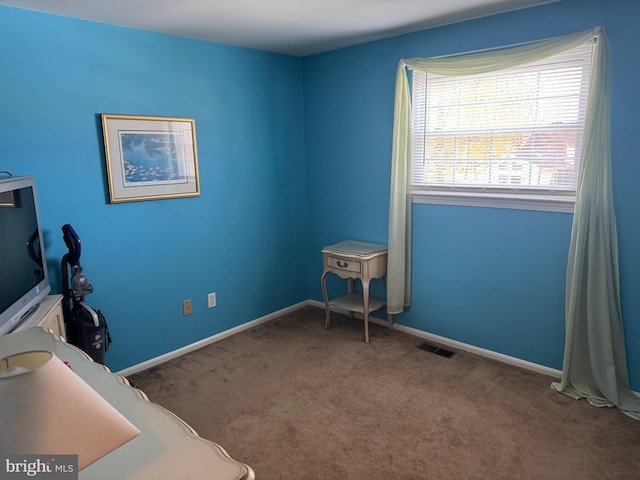 bedroom with carpet flooring, visible vents, and baseboards