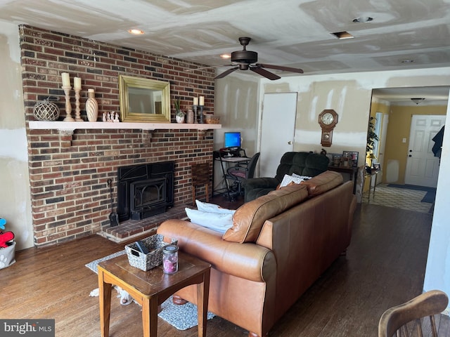 living area with ceiling fan and wood finished floors