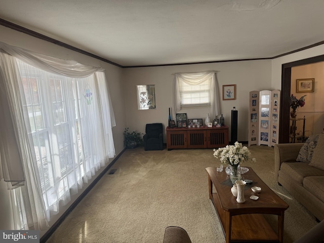 living room featuring ornamental molding, light carpet, and visible vents