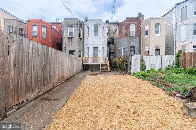 exterior space with fence and a residential view