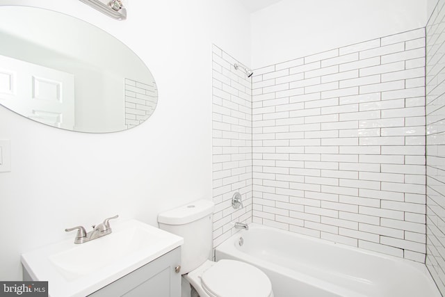 bathroom with toilet, washtub / shower combination, and vanity