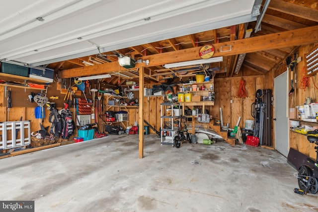 garage featuring a workshop area and a garage door opener