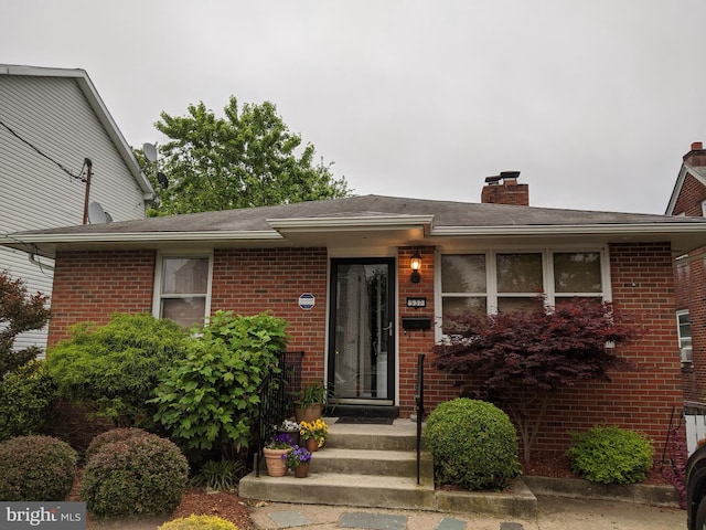 view of front facade featuring brick siding