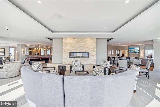 living area with recessed lighting, a raised ceiling, and billiards