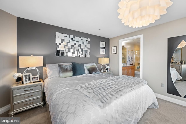 bedroom with carpet flooring, connected bathroom, and baseboards