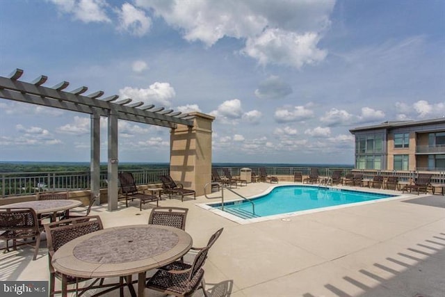 pool featuring a patio area, fence, and a pergola