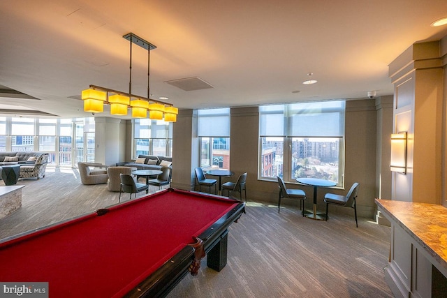 game room featuring pool table and a city view