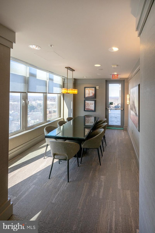 dining area featuring dark carpet and recessed lighting