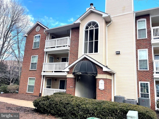 view of building exterior with central AC