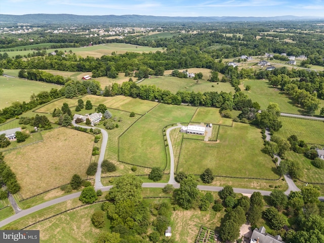 birds eye view of property with a rural view