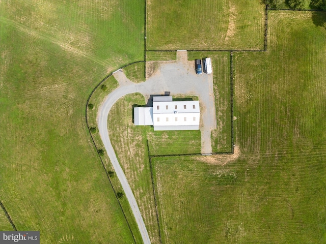 birds eye view of property with a rural view