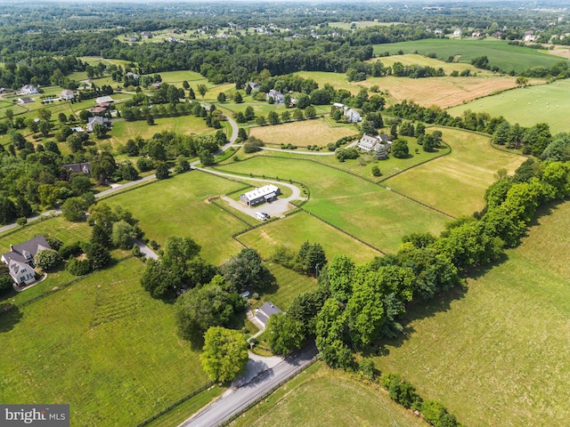 birds eye view of property with a rural view