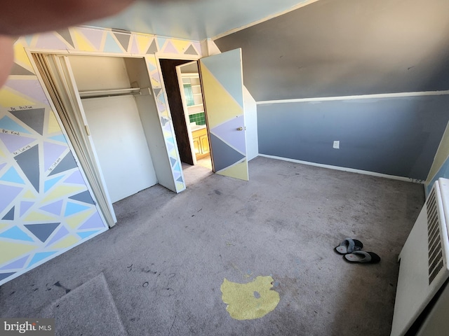 unfurnished bedroom featuring a closet and carpet flooring