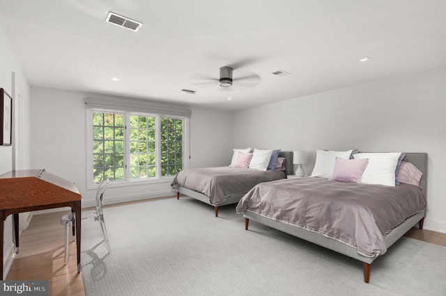 bedroom with wood finished floors, visible vents, baseboards, recessed lighting, and ceiling fan